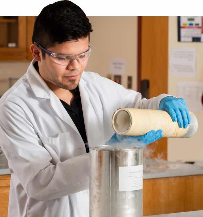 Student performing a chemistry experiment.